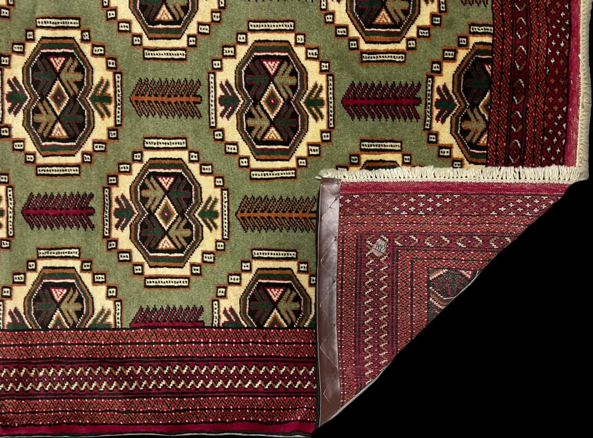 Persian rug of Turkoman style in dimensions 193 centimeters length by 130 centimeters width with mainly red and green colors — Folded
