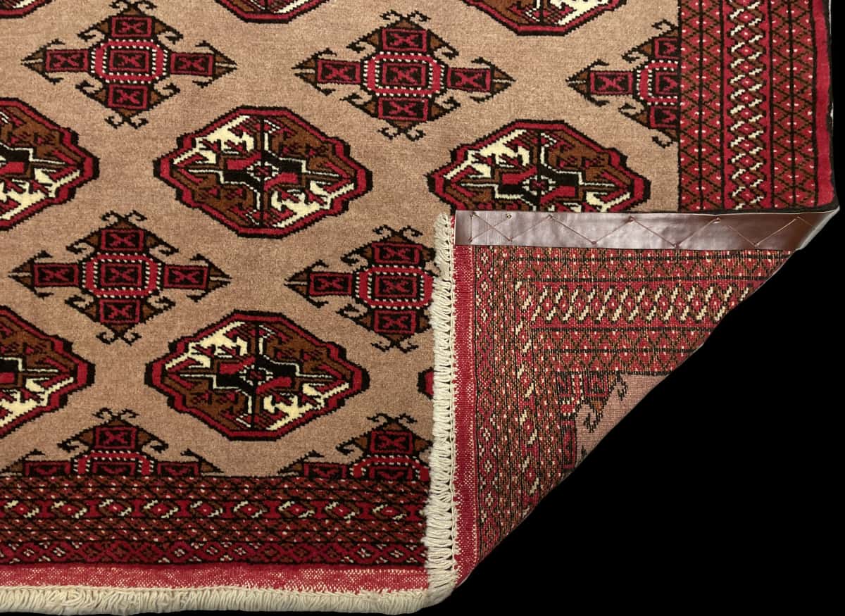 Persian rug of Turkoman style in dimensions 190 centimeters length by 130 centimeters width with mainly red and brown colors — Folded