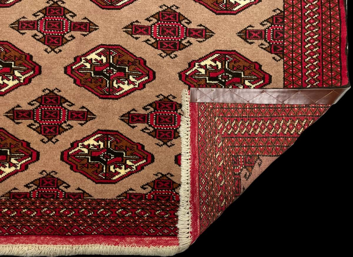 Persian rug of Turkoman style in dimensions 190 centimeters length by 130 centimeters width with mainly red and brown colors — Folded