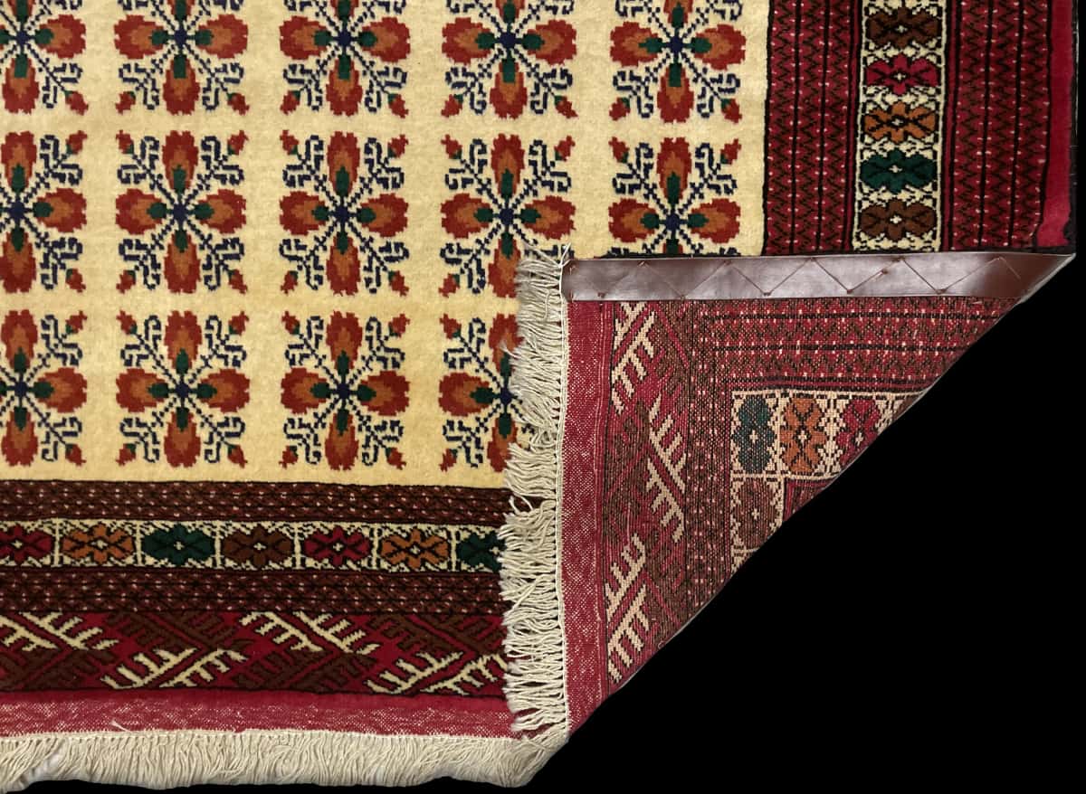 Persian rug of Turkoman style in dimensions 194 centimeters length by 132 centimeters width with mainly red and beige colors — Folded