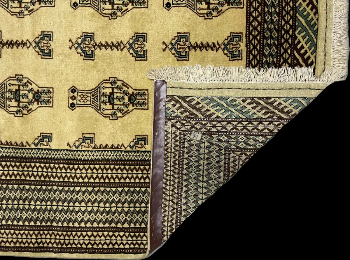 Persian rug in dimensions 192 centimeters length by 130 centimeters width with mainly yellow colors — Folded