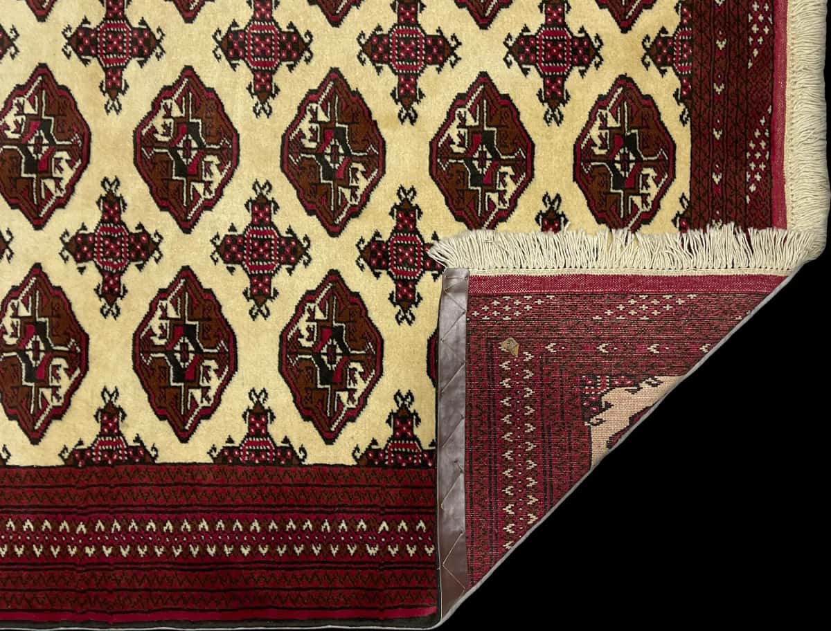 Persian rug in dimensions 190 centimeters length by 132 centimeters width with mainly red and beige colors — Folded