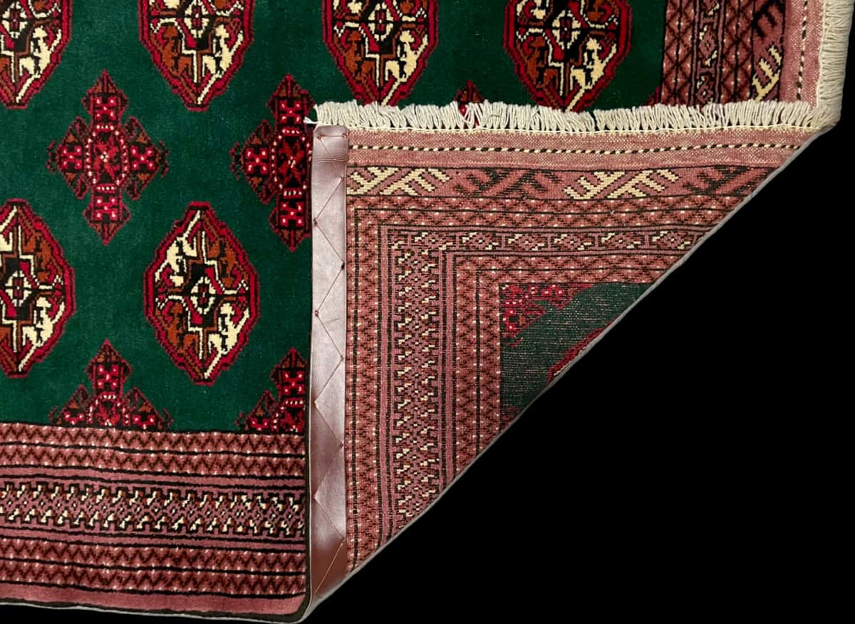 Persian rug of Turkoman style in dimensions 196 centimeters length by 132 centimeters width with mainly green colors — Folded