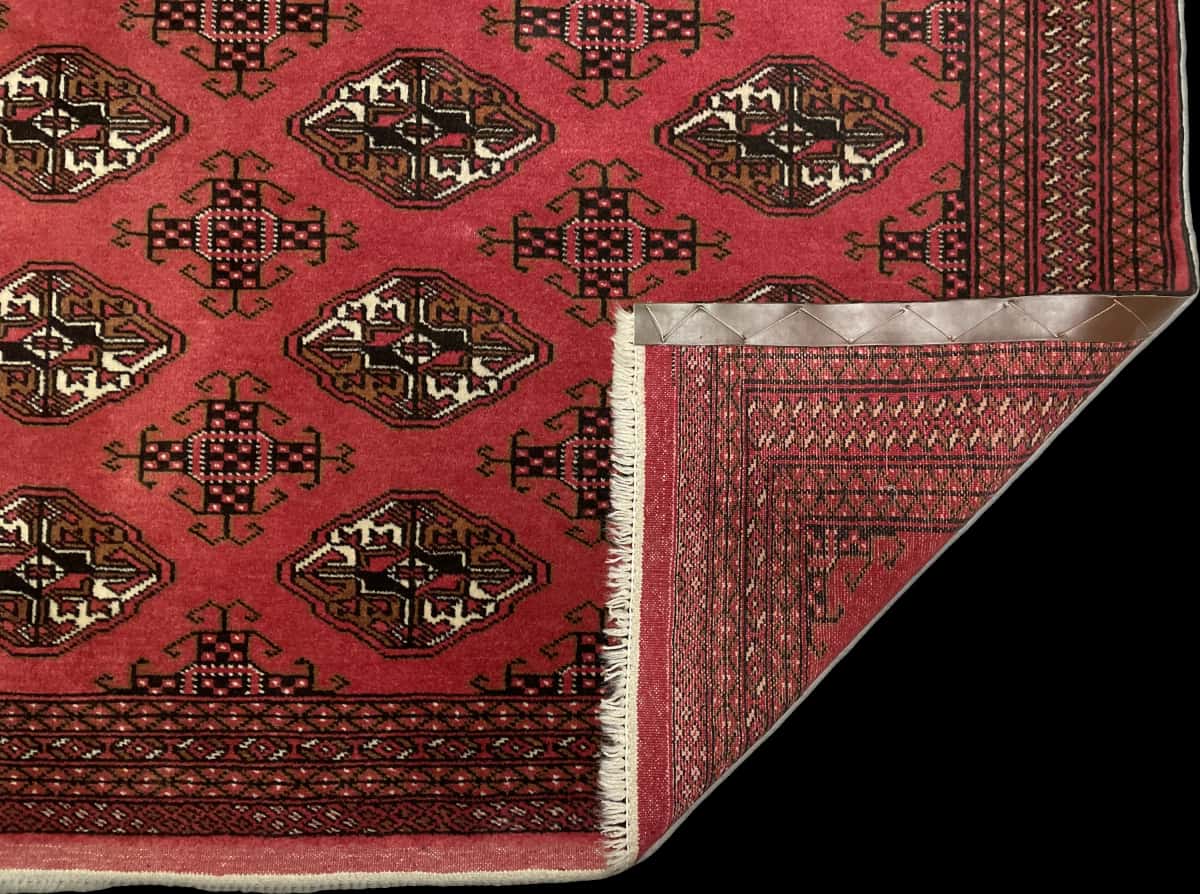 Persian rug of Turkoman style in dimensions 193 centimeters length by 136 centimeters width with mainly red colors — Folded