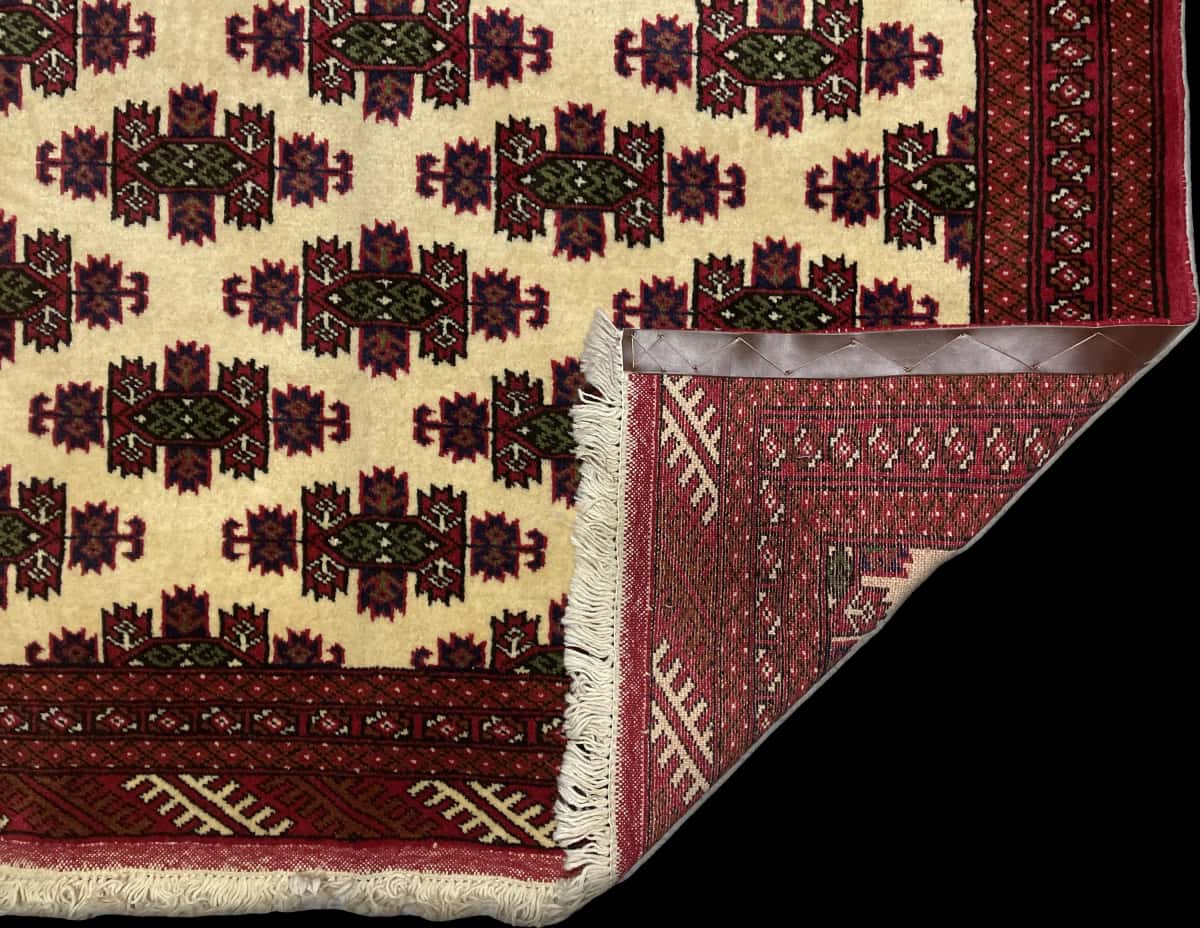 Persian rug of Turkoman style in dimensions 185 centimeters length by 132 centimeters width with mainly red and beige colors — Folded