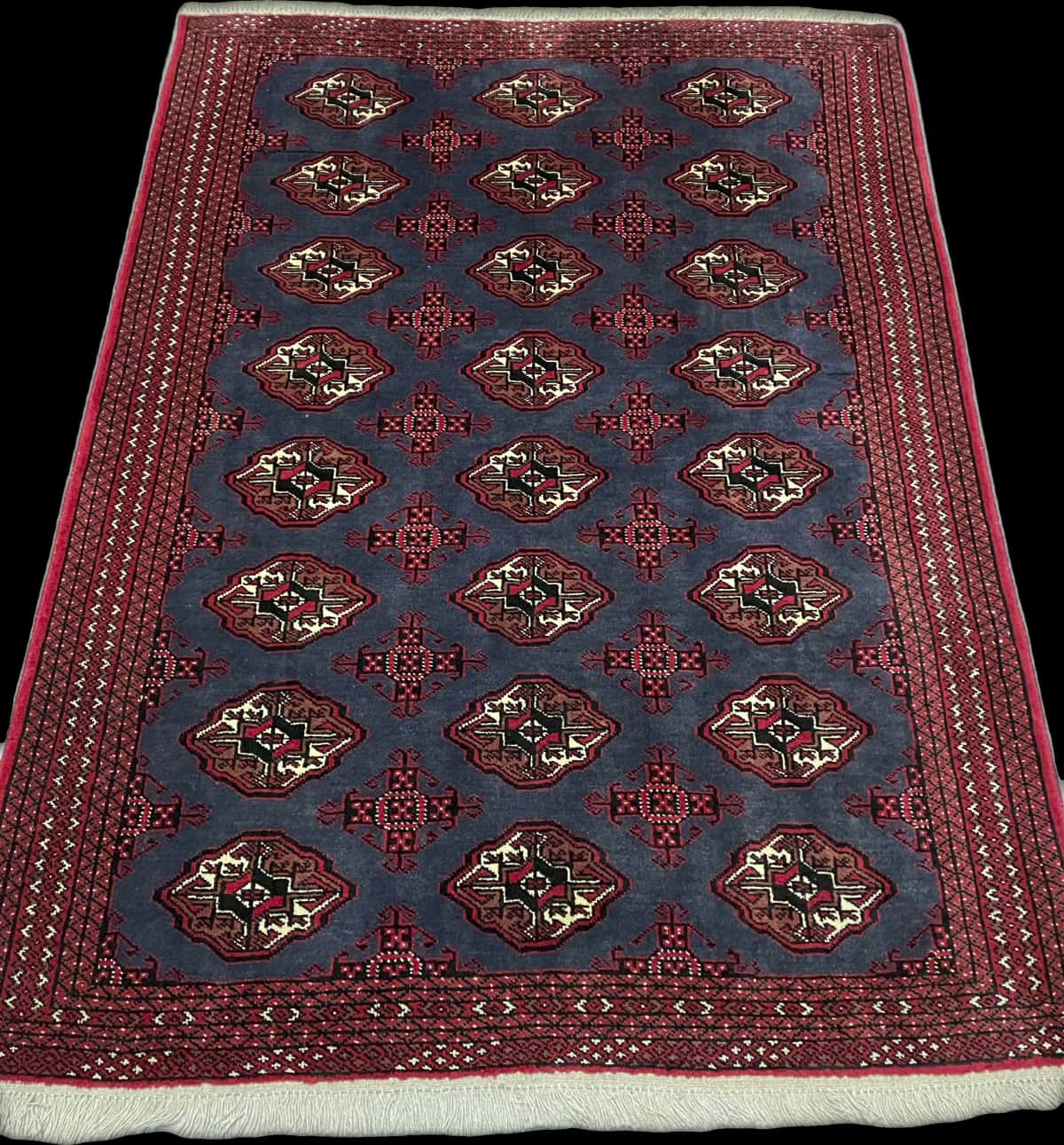 Persian rug of Turkoman style in dimensions 179 centimeters length by 130 centimeters width with mainly red and blue colors — Perspective