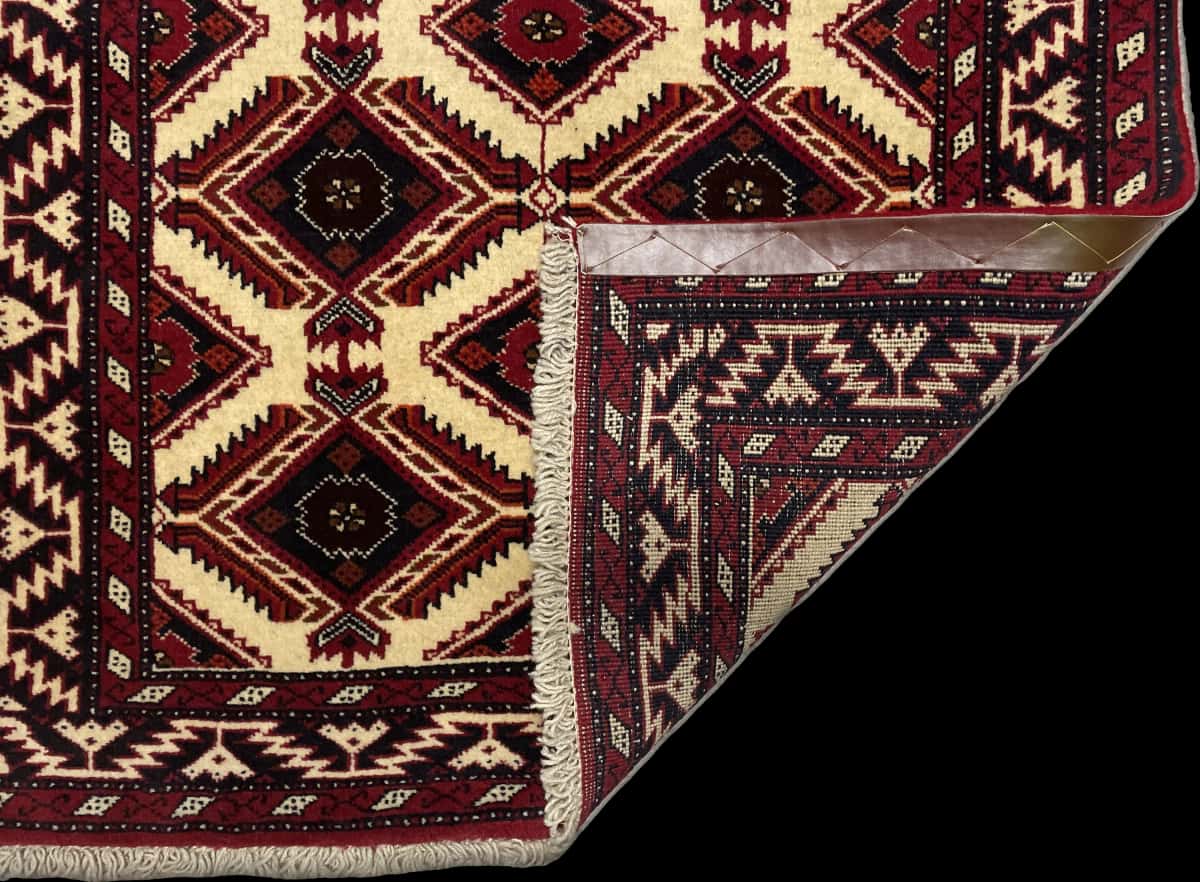 Persian rug of Baluch style in dimensions 196 centimeters length by 96 centimeters width with mainly beige colors — Folded