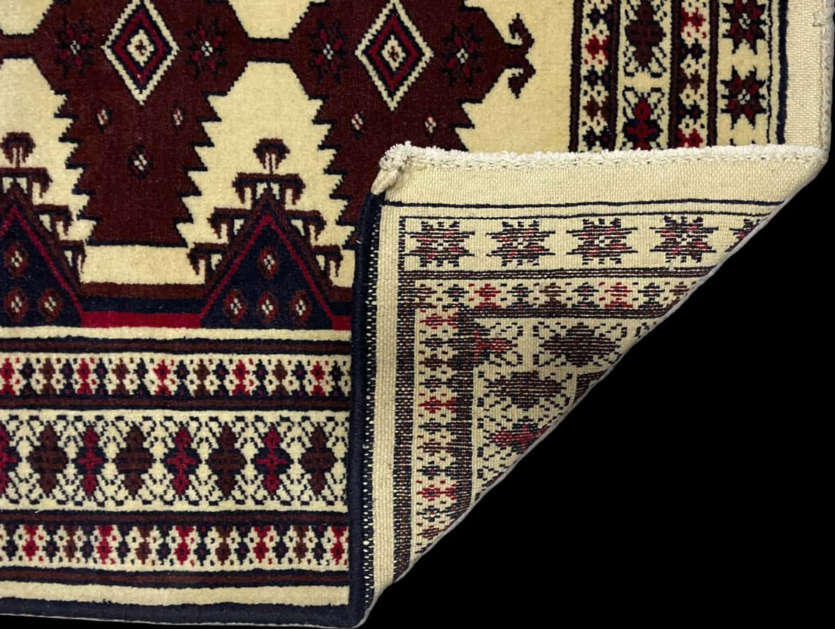 Persian rug in dimensions 112 centimeters length by 79 centimeters width with mainly beige and brown colors — Folded
