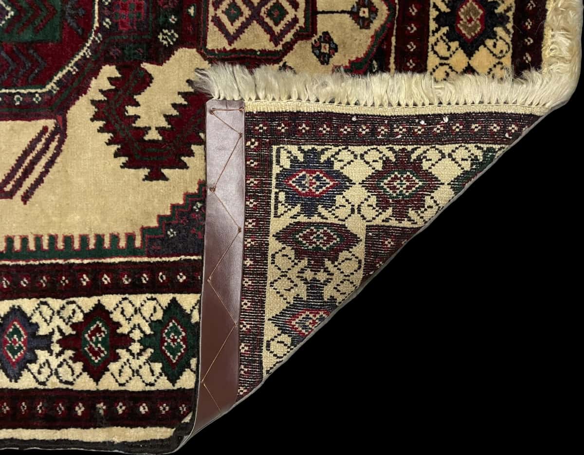 Persian rug of Turkoman style in dimensions 113 centimeters length by 90 centimeters width with mainly beige and yellow colors — Folded