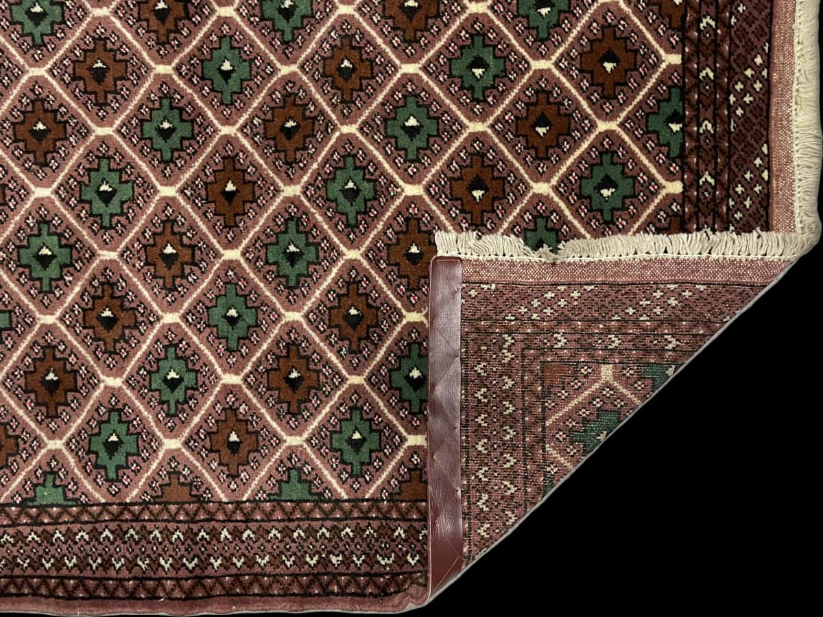 Persian rug in dimensions 140 centimeters length by 100 centimeters width with mainly brown colors — Folded
