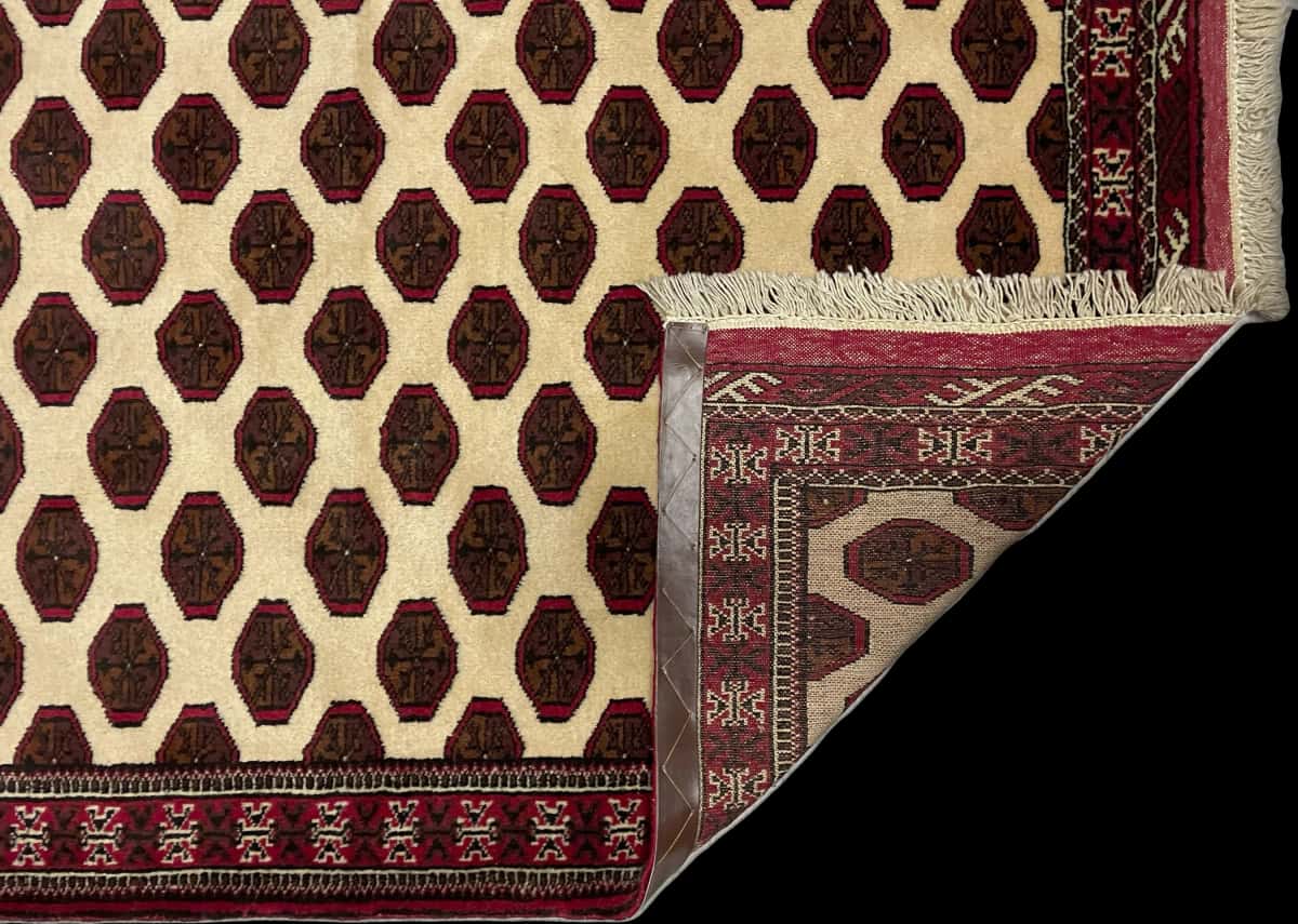 Persian rug of Turkoman style in dimensions 165 centimeters length by 105 centimeters width with mainly beige and brown colors — Folded