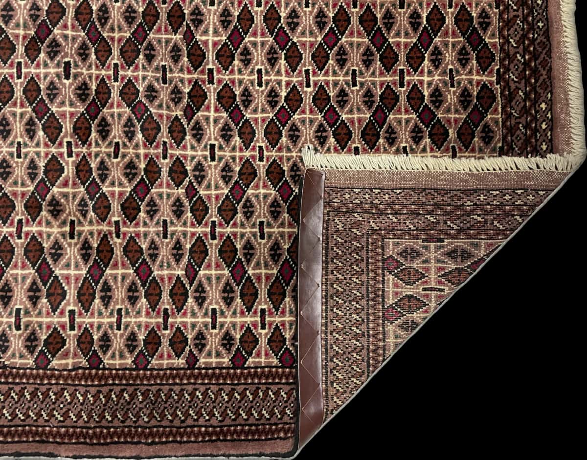 Persian rug of Turkoman style in dimensions 142 centimeters length by 98 centimeters width with mainly brown colors — Folded