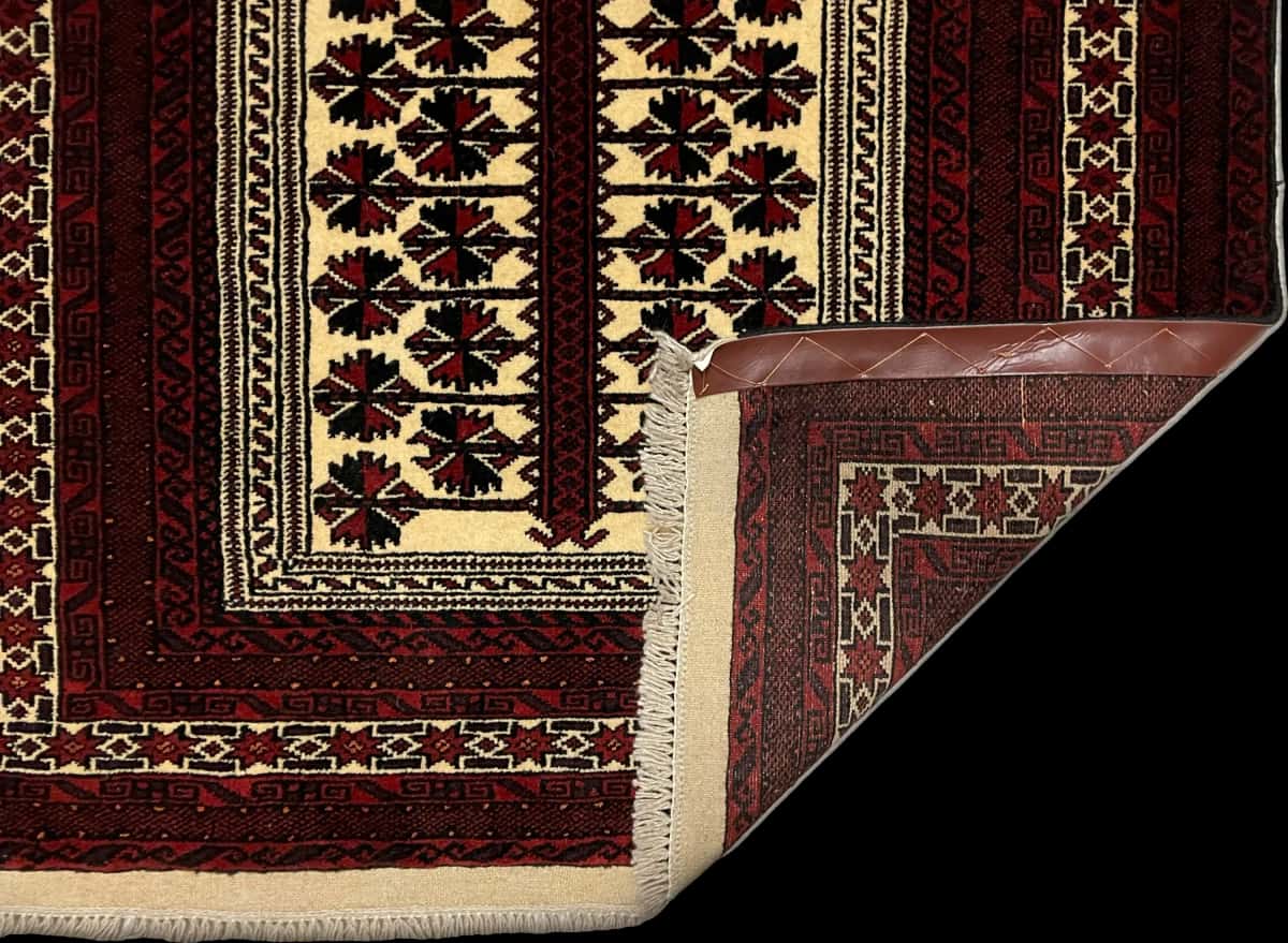 Persian rug of Turkoman style in dimensions 158 centimeters length by 106 centimeters width with mainly red and beige colors — Folded
