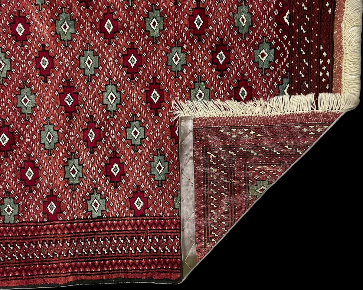 Persian rug of Turkoman style in dimensions 150 centimeters length by 102 centimeters width with mainly brown and red colors — Folded