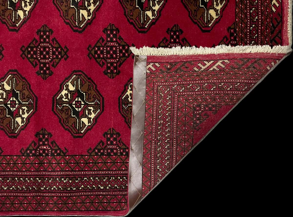 Persian rug of Turkoman style in dimensions 150 centimeters length by 104 centimeters width with mainly red colors — Folded