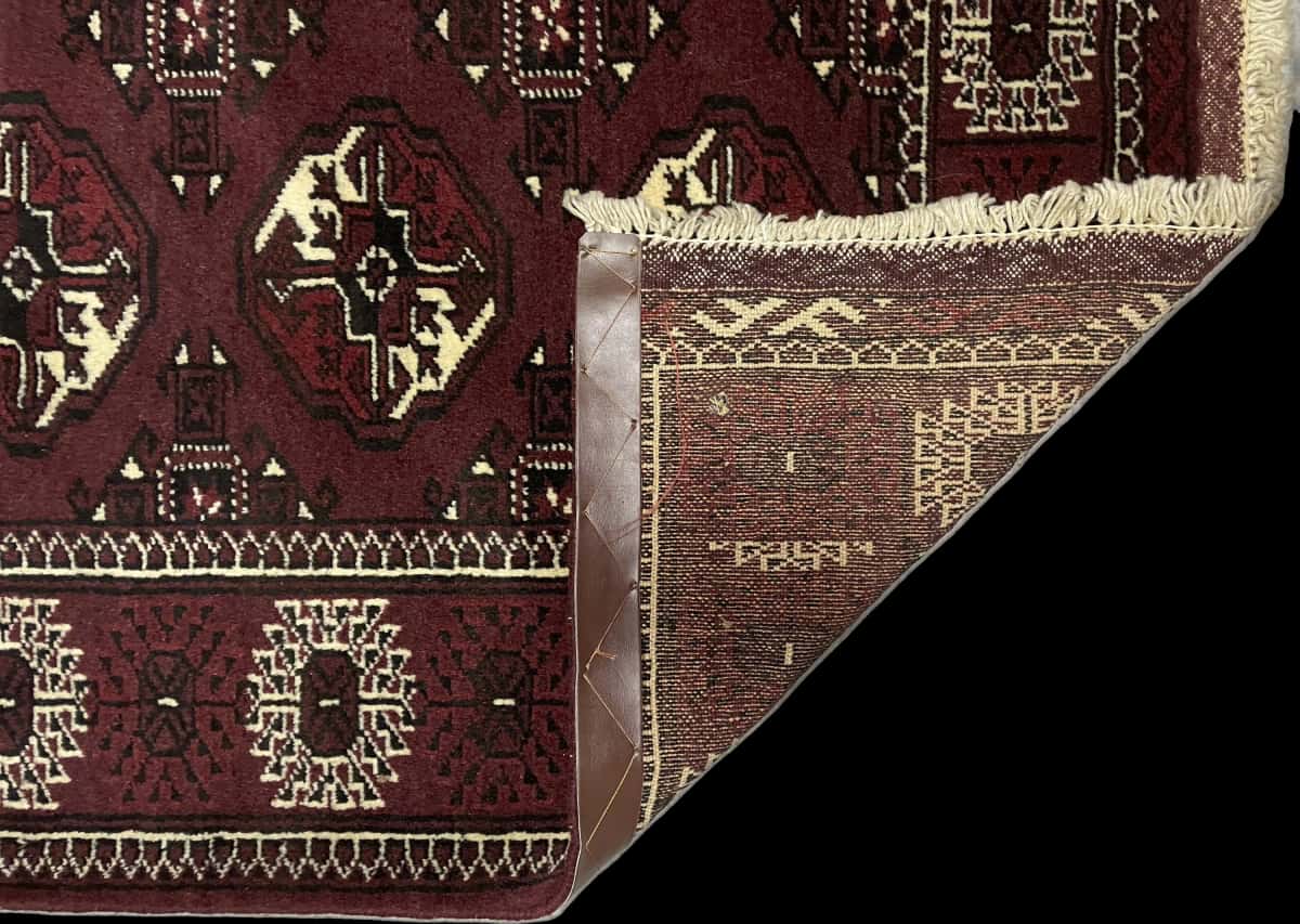 Persian rug of Turkoman style in dimensions 146 centimeters length by 100 centimeters width with mainly brown colors — Folded