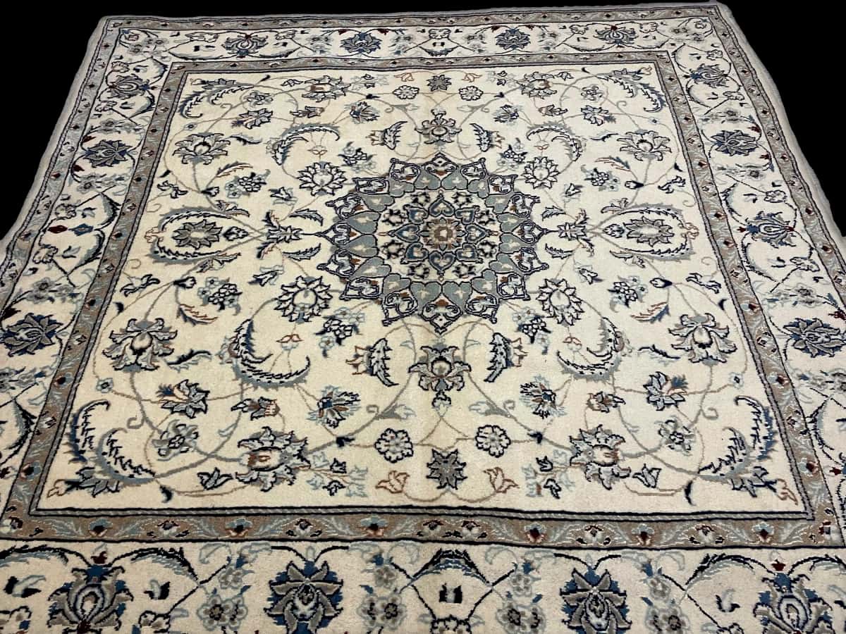 Persian rug of Nain style in dimensions 205 centimeters length by 200 centimeters width with mainly beige colors — Perspective