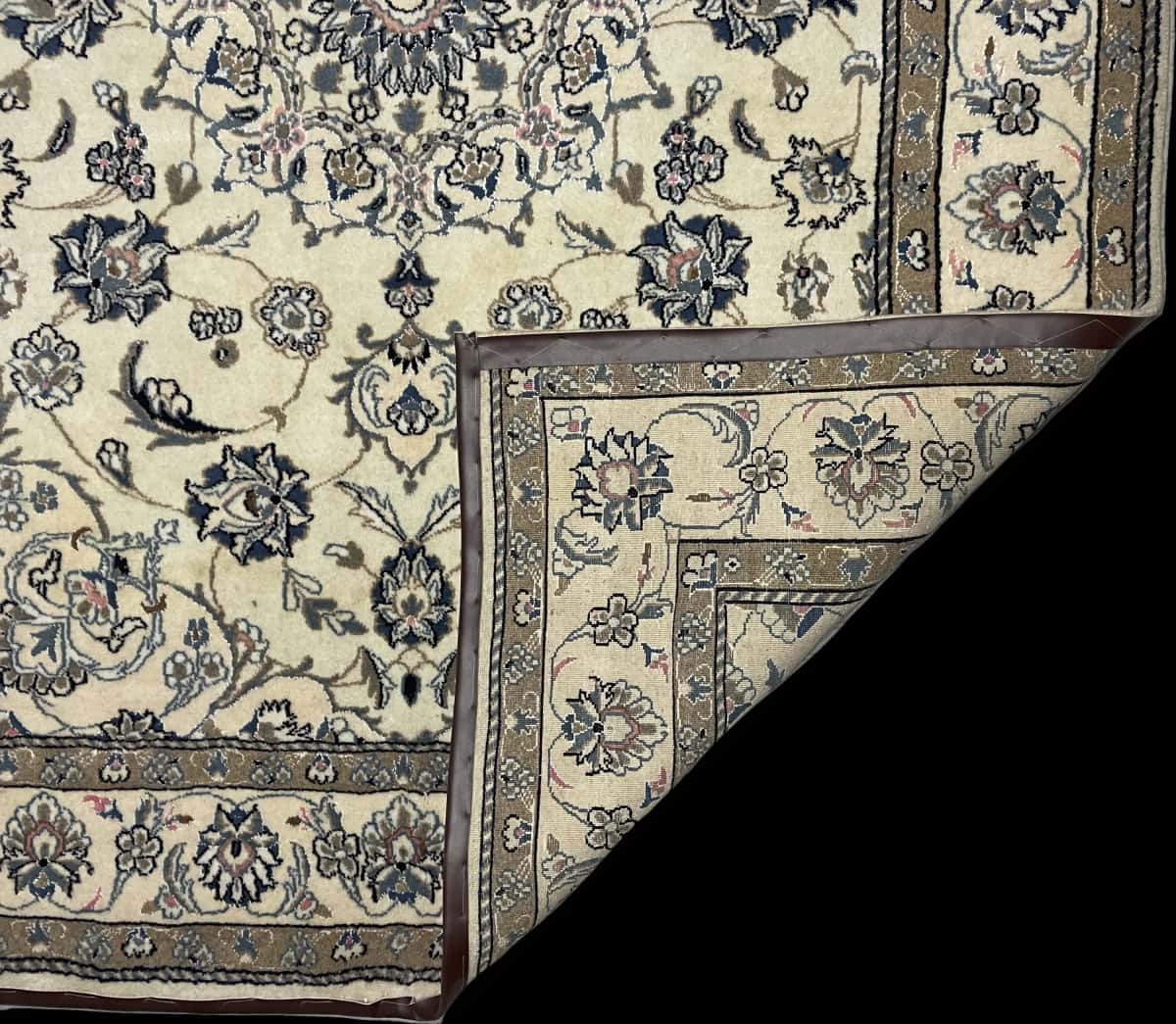 Persian rug of Nain style in dimensions 227 centimeters length by 167 centimeters width with mainly beige and blue colors — Folded