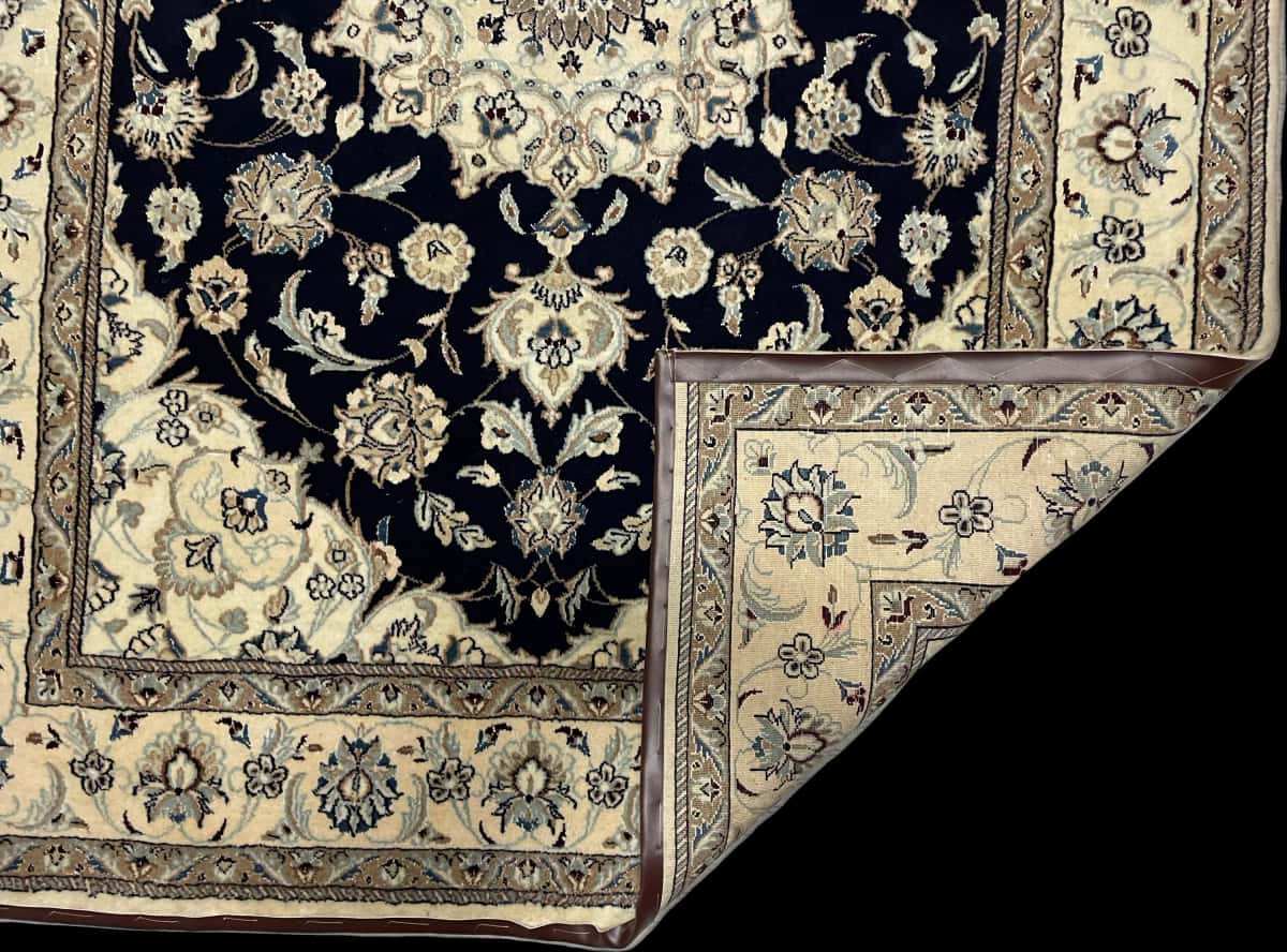 Persian rug of Nain style in dimensions 229 centimeters length by 168 centimeters width with mainly beige and blue colors — Folded