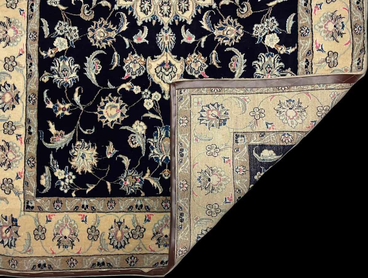 Persian rug of Nain style in dimensions 252 centimeters length by 160 centimeters width with mainly beige and blue colors — Folded
