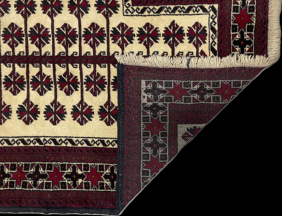 Persian rug of Turkoman style in dimensions 145 centimeters length by 101 centimeters width with mainly beige and red colors — Folded