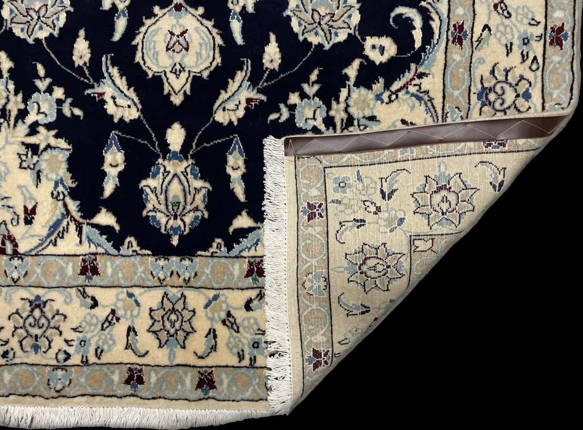 Persian rug of Nain style in dimensions 214 centimeters length by 148 centimeters width with mainly beige and blue colors — Folded