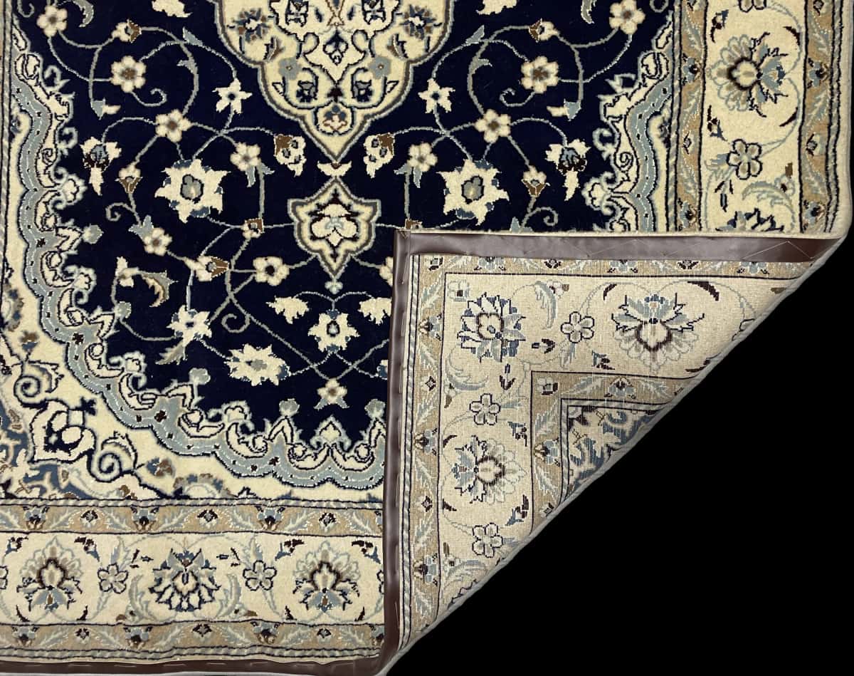 Persian rug of Nain style in dimensions 238 centimeters length by 160 centimeters width with mainly beige and blue colors — Folded