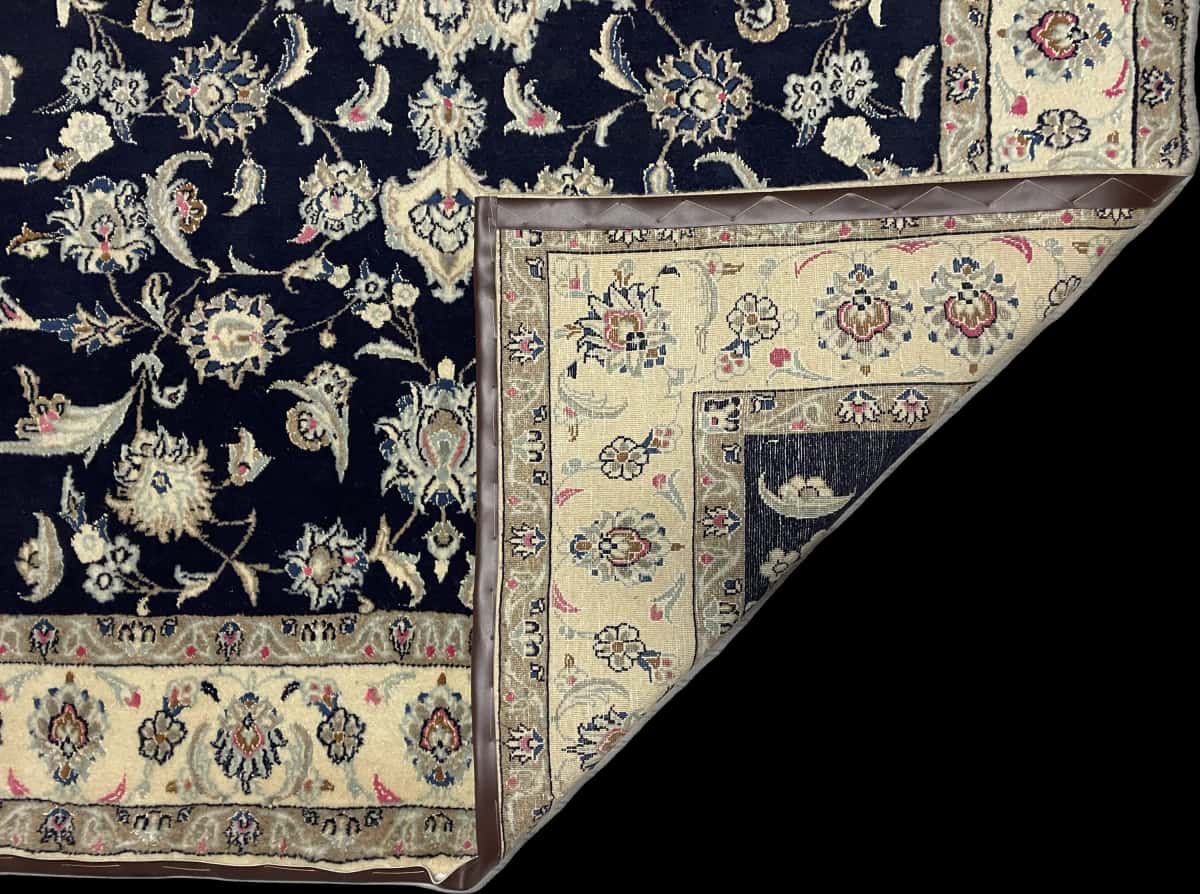 Persian rug of Nain style in dimensions 232 centimeters length by 168 centimeters width with mainly blue colors — Folded