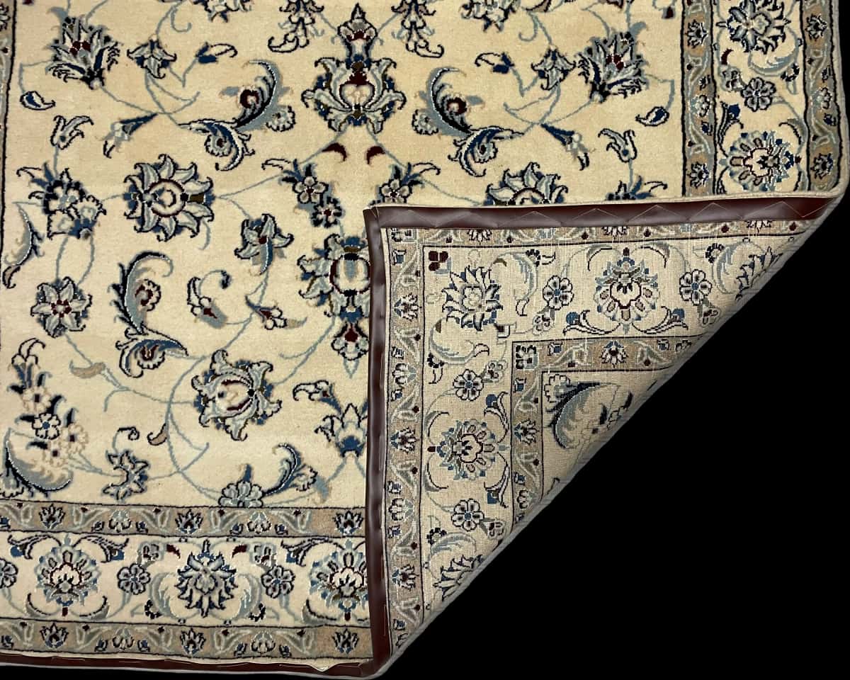 Persian rug of Nain style in dimensions 240 centimeters length by 162 centimeters width with mainly beige colors — Folded