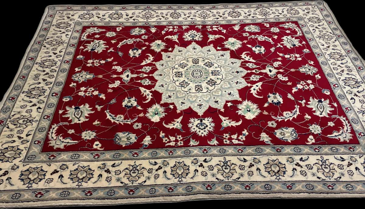 Persian rug of Nain style in dimensions 208 centimeters length by 150 centimeters width with mainly red colors — Perspective