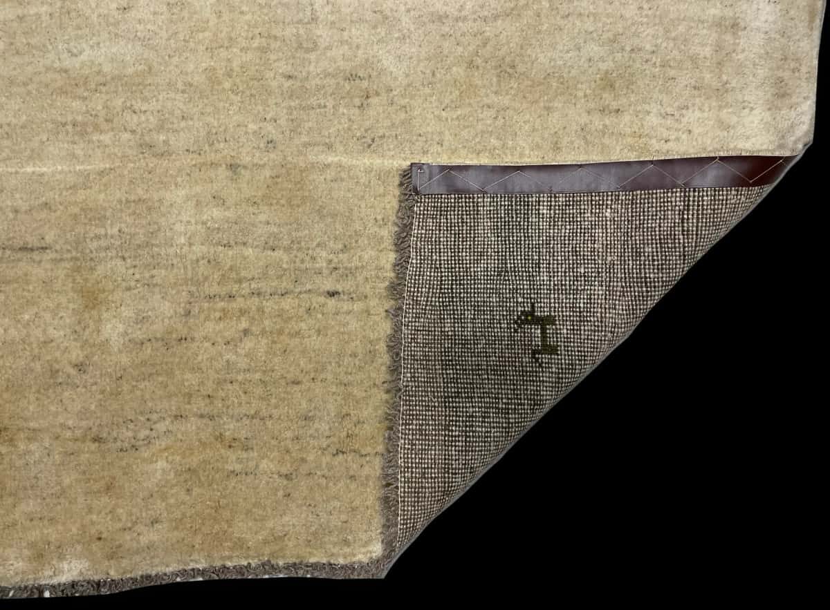 Persian rug of Gabbeh style in dimensions 187 centimeters length by 135 centimeters width with mainly beige colors — Folded