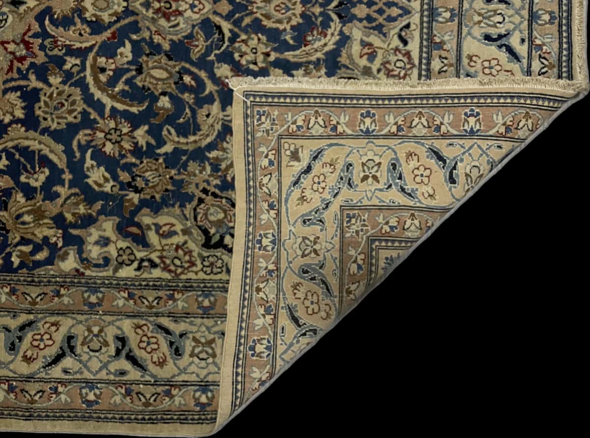 Persian rug of Nain style in dimensions 203 centimeters length by 122 centimeters width with mainly blue colors — Folded