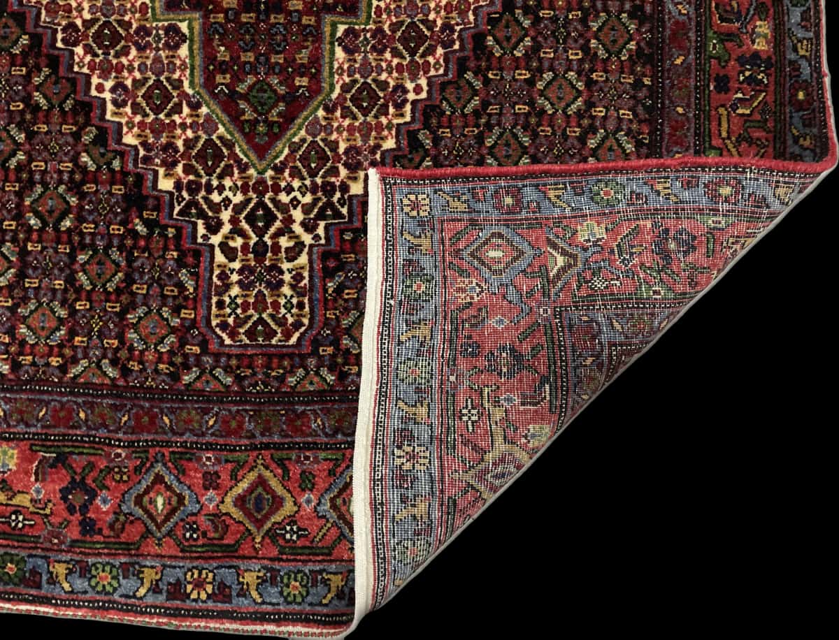 Persian rug of Sanandaj style in dimensions 182 centimeters length by 130 centimeters width with mainly colorful colors — Folded