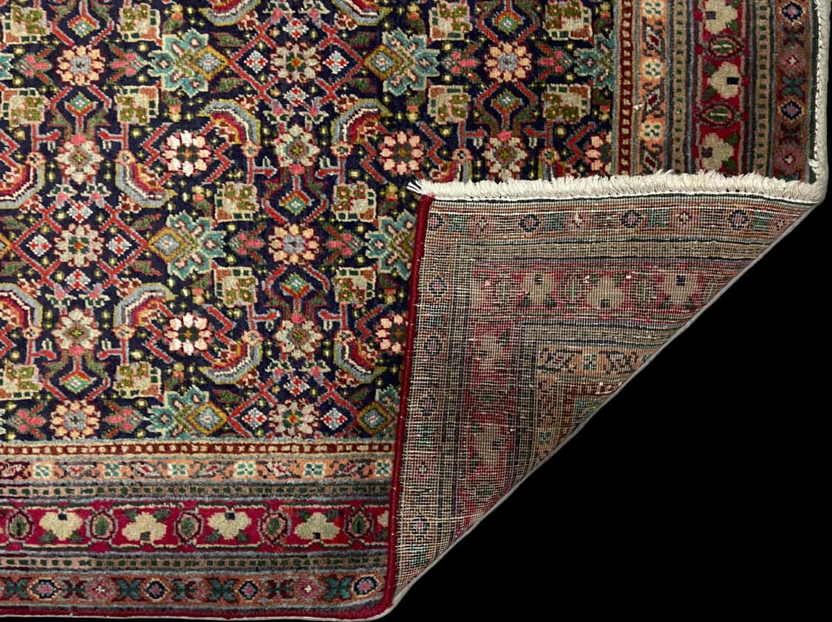 Persian rug of Bijar style in dimensions 156 centimeters length by 109 centimeters width with mainly colorful colors — Folded