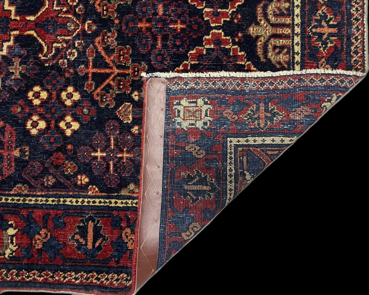 Persian rug of Kerman style in dimensions 157 centimeters length by 100 centimeters width with mainly red and blue colors — Folded