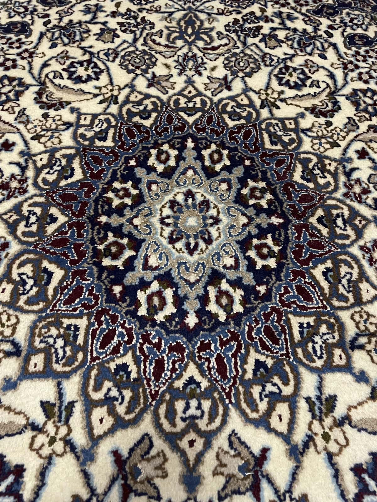 Persian rug in dimensions 202 centimeters length by 122 centimeters width with mainly blue and beige colors — Perspective