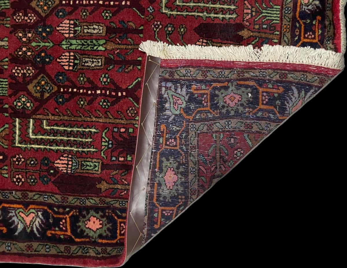 Persian rug of Nasrabad style in dimensions 162 centimeters length by 112 centimeters width with mainly red colors — Folded