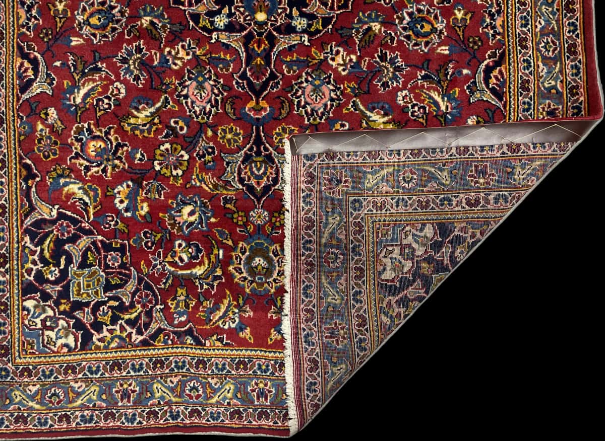 Persian rug of Kashan style in dimensions 184 centimeters length by 120 centimeters width with mainly red and blue colors — Folded