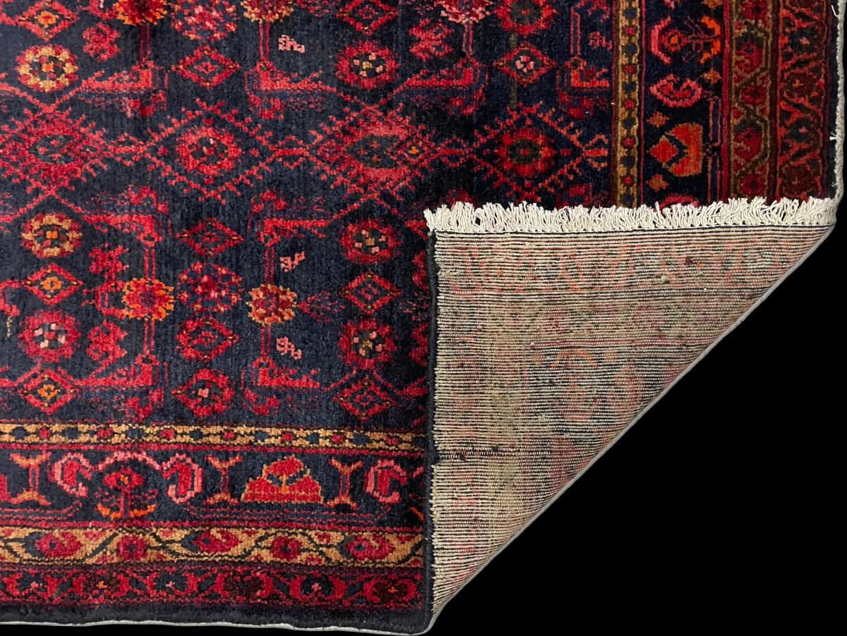 Persian rug of Turkoman style in dimensions 164 centimeters length by 106 centimeters width with mainly red and blue colors — Folded
