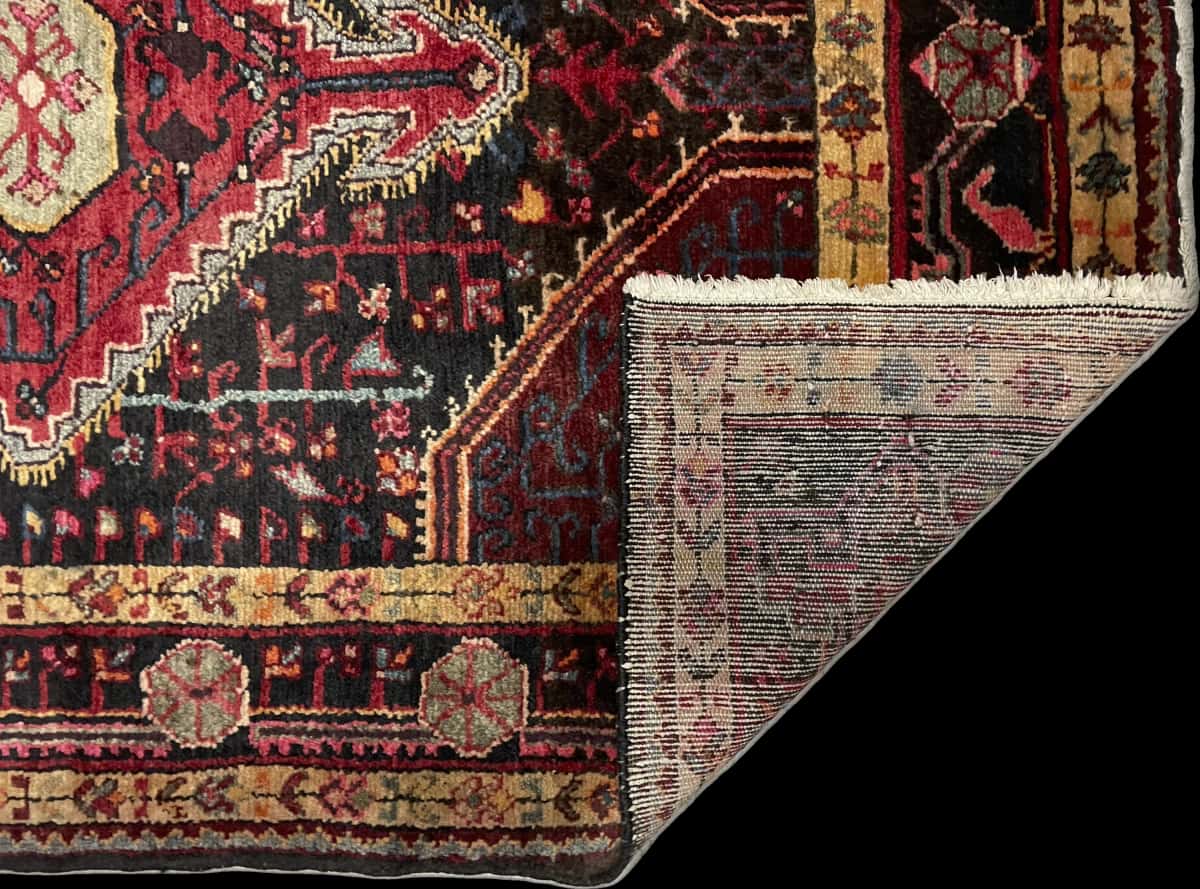 Persian rug of Sirjan style in dimensions 160 centimeters length by 113 centimeters width with mainly red and beige colors — Folded