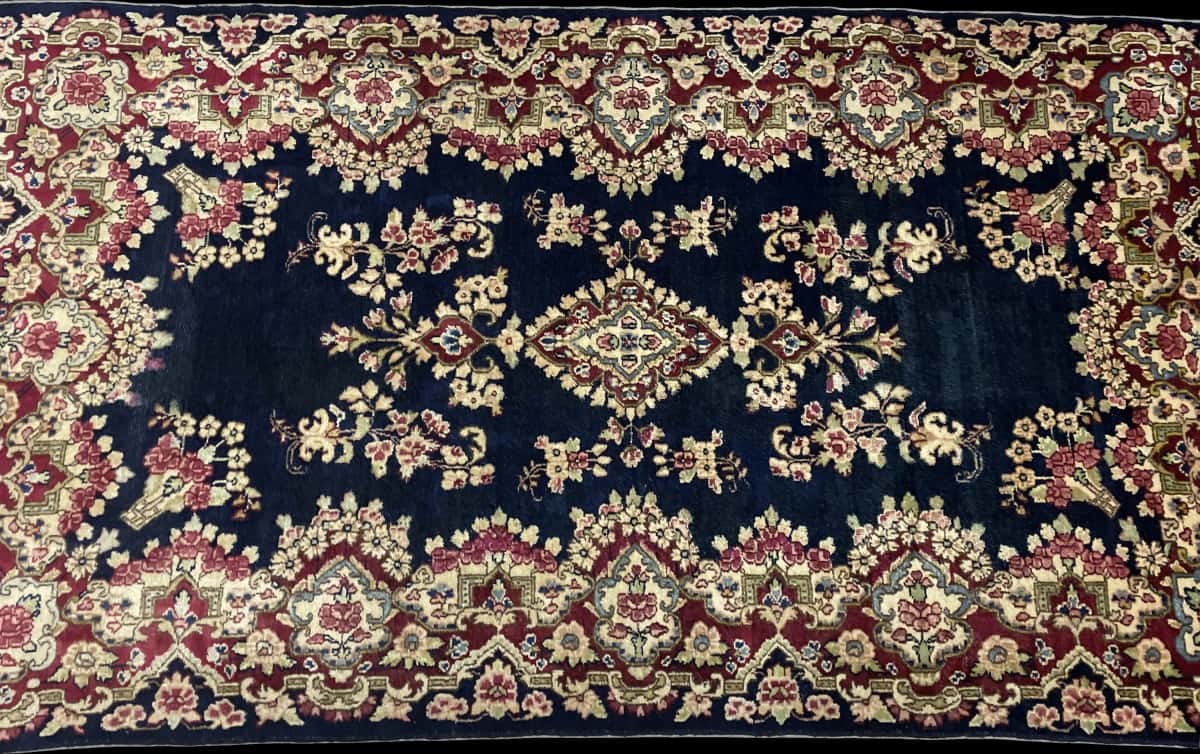 Persian rug of Kerman style in dimensions 217 centimeters length by 123 centimeters width with mainly red and blue colors — Perspective