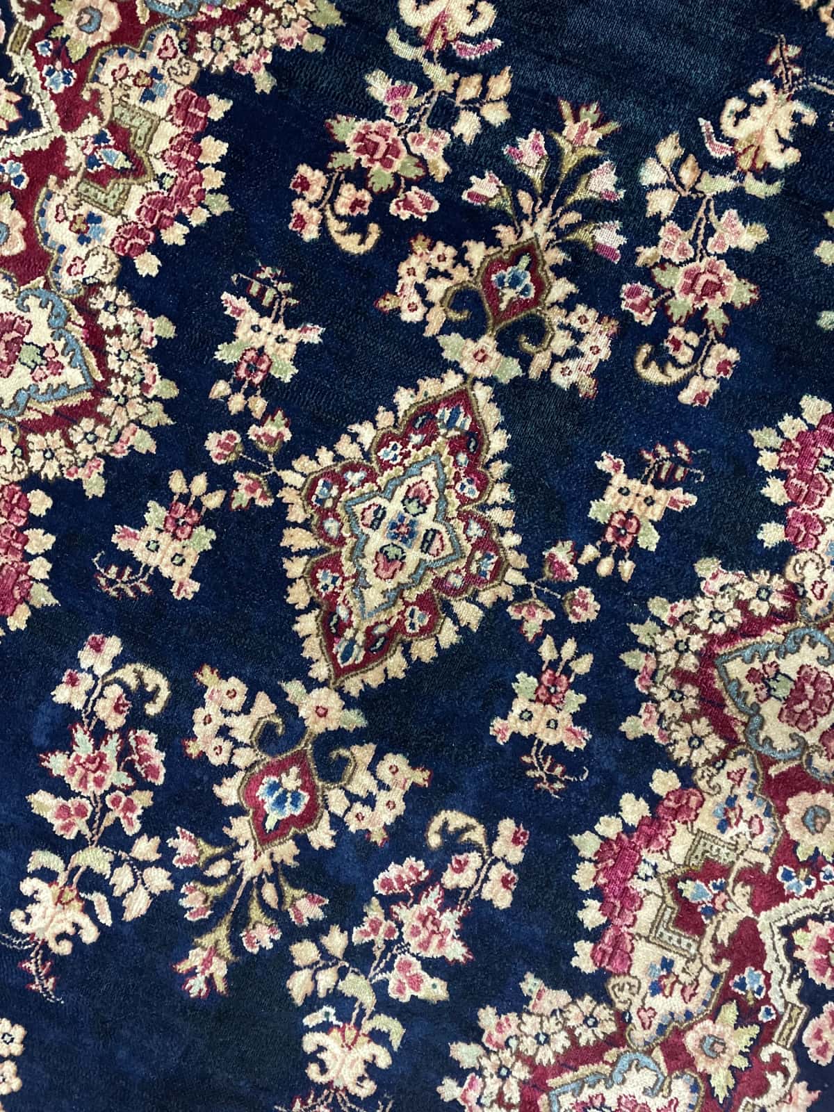 Persian rug of Kerman style in dimensions 217 centimeters length by 123 centimeters width with mainly red and blue colors — Perspective