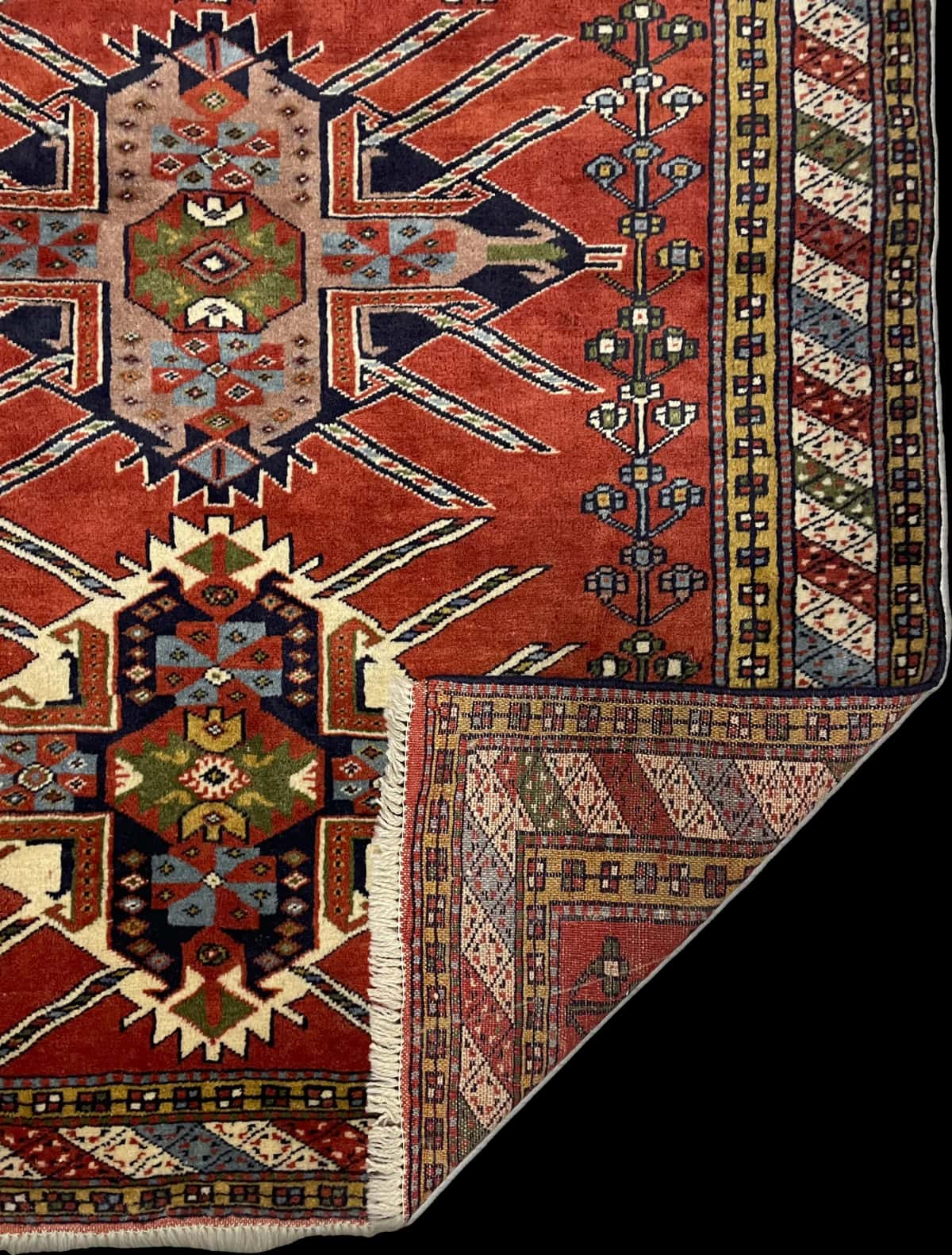 Persian rug of Quchan style in dimensions 170 centimeters length by 130 centimeters width with mainly orange colors — Folded