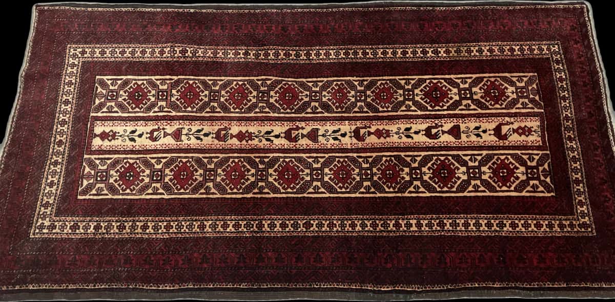 Persian rug of Baluch style in dimensions 205 centimeters length by 108 centimeters width with mainly red colors — Perspective