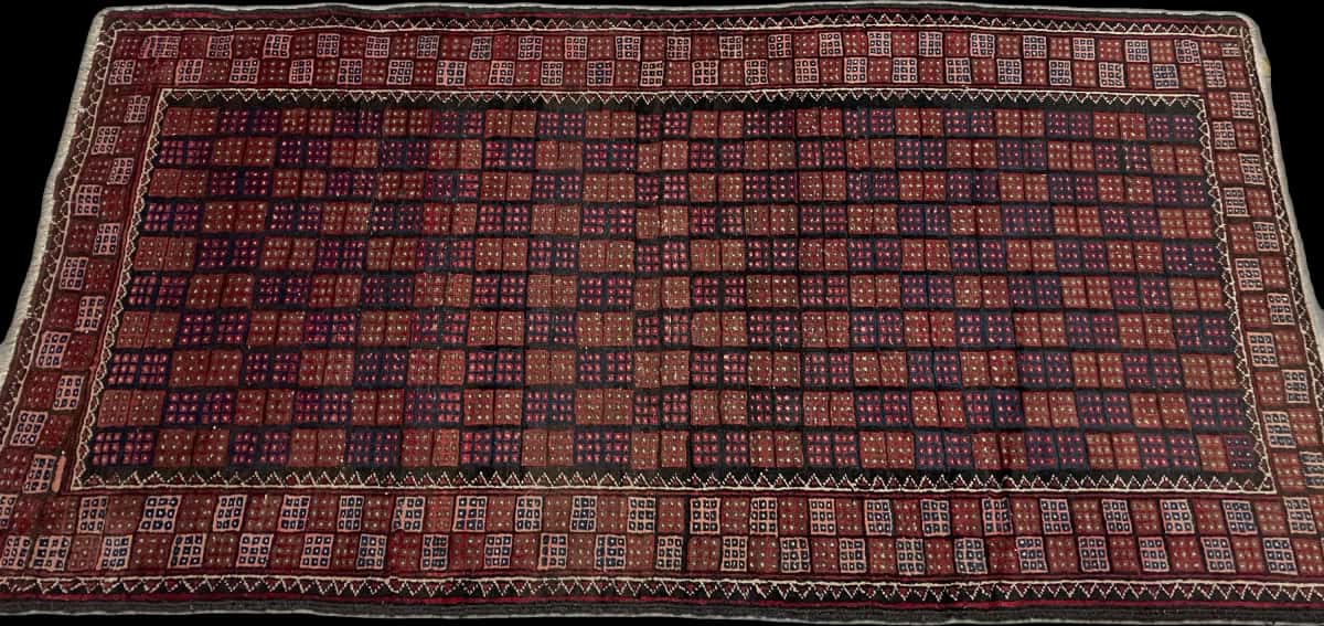 alfombra persa de estilo baluch en dimensiones 170 centímetros de largo por 93 centímetros de ancho con colores principalmente marrón y azul — Perspectiva