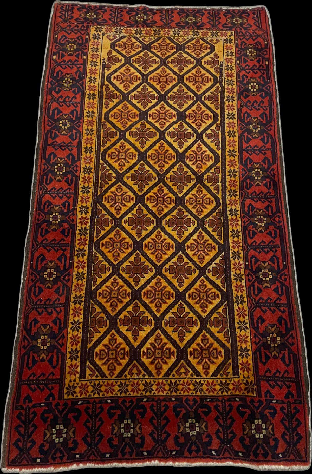 alfombra persa de estilo baluch en dimensiones 176 centímetros de largo por 91 centímetros de ancho con colores principalmente naranja y amarillo — Perspectiva