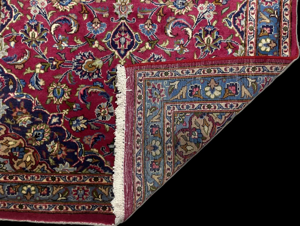 Persian rug of Kashmar style in dimensions 217 centimeters length by 110 centimeters width with mainly red and blue colors — Folded