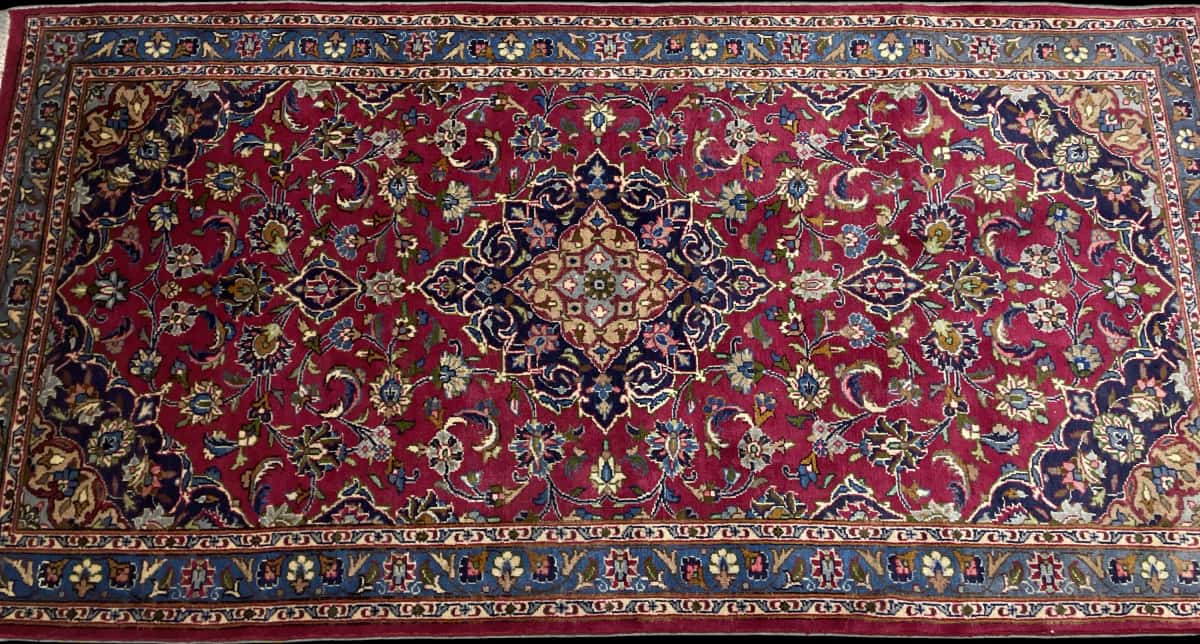 Persian rug of Kashmar style in dimensions 217 centimeters length by 110 centimeters width with mainly red and blue colors — Perspective