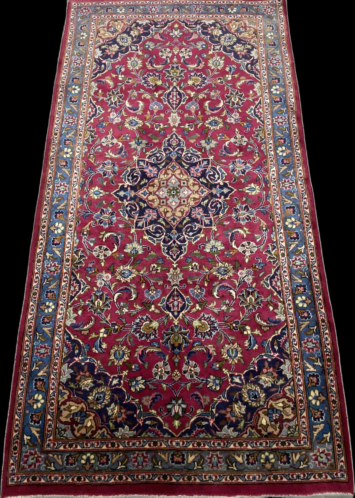Persian rug of Kashmar style in dimensions 217 centimeters length by 110 centimeters width with mainly red and blue colors — Perspective