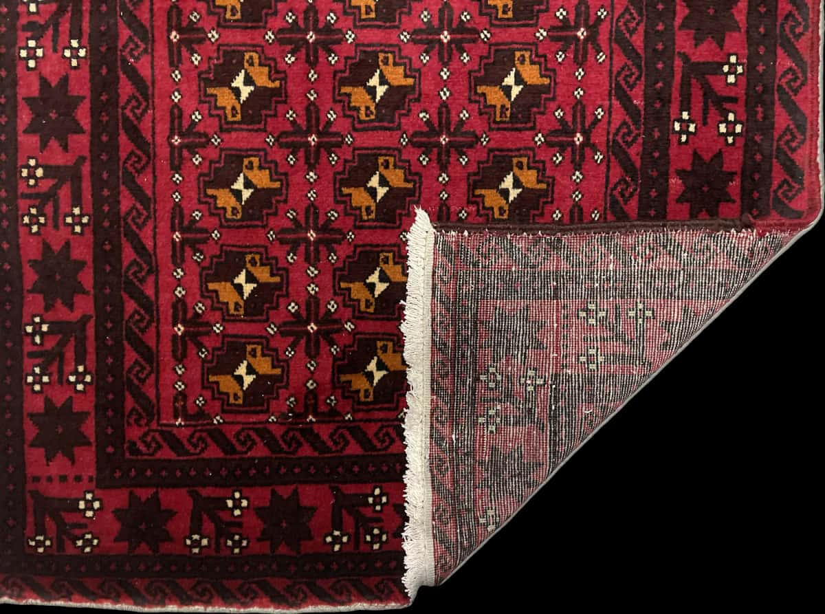 Persian rug of Baluch style in dimensions 200 centimeters length by 100 centimeters width with mainly red colors — Folded